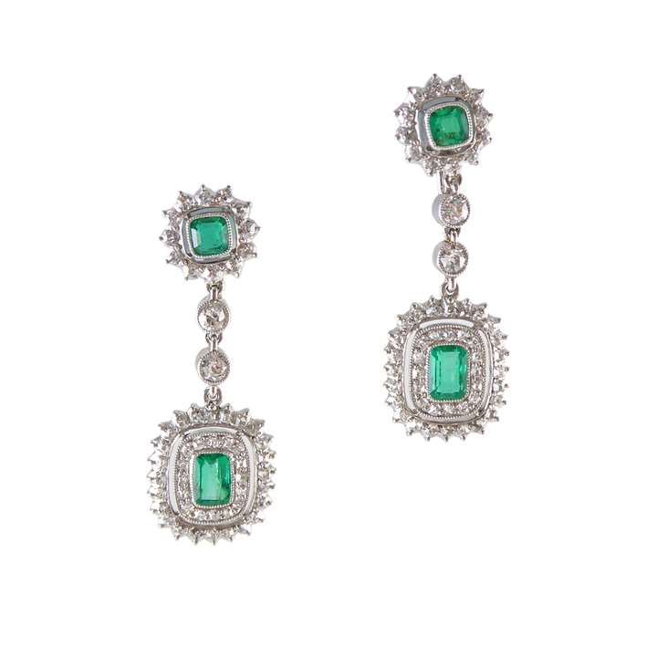Pair of early 20th century emerald and diamond cluster pendant earrings, English c.1910, possibly by Garrard & Co.,